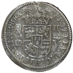 1708. Monograma de Felipe V. 2 reales. Ingenio de Segovia. Ensayador Y (Isidro Párraga). Variante palma izquierda sobre la derecha. (Vano a las "12" en anverso y reverso por ser final de riel).