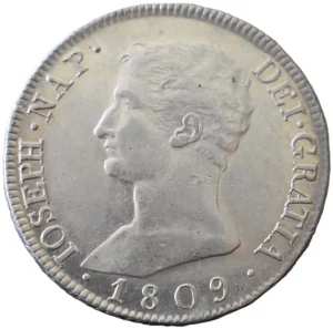 Moneda de 20 reales del reinado de José Napoleón. Año 1809. Ceca de Madrid. Ensayador AI. Conservación: Sin Circular. Peso: 26,6 gramos. Diámetro: 40 mm.